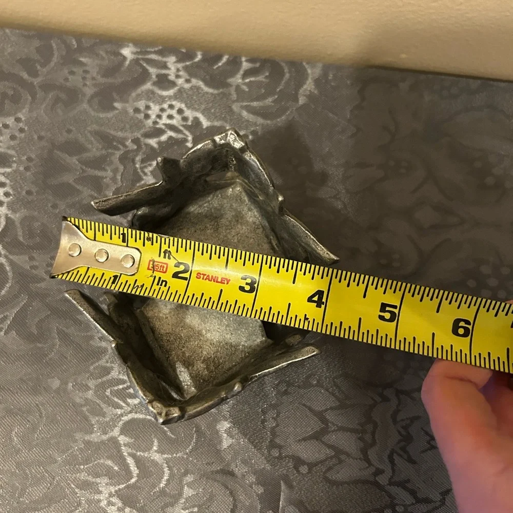 Pewter candle holder features hummingbirds and hearts